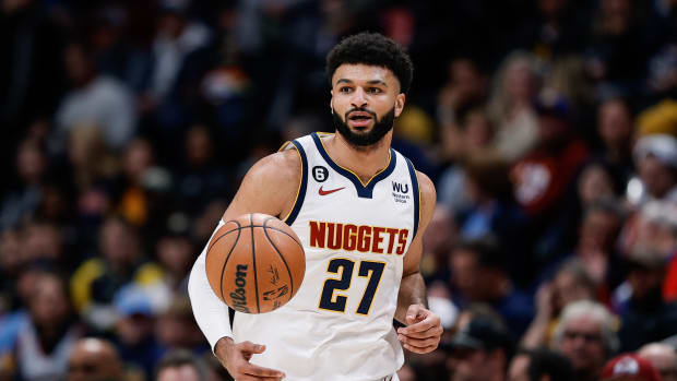 Jamal Murray dribbles up the court.